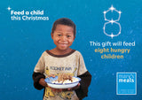 Virtual charity Christmas gift card design featuring smiling young boy holding a plate of food against a blue starry background with text reading 'Feed a child this Christmas'. A Mary's Meals logo appears in the lower right.